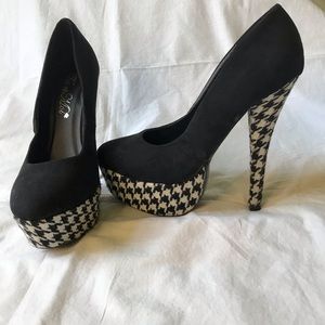 Black platform heels with black and white heels